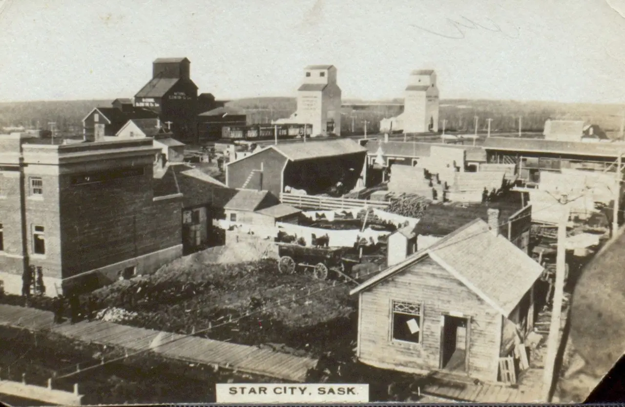 View of Star City with grain elevators and buildings, about 1910